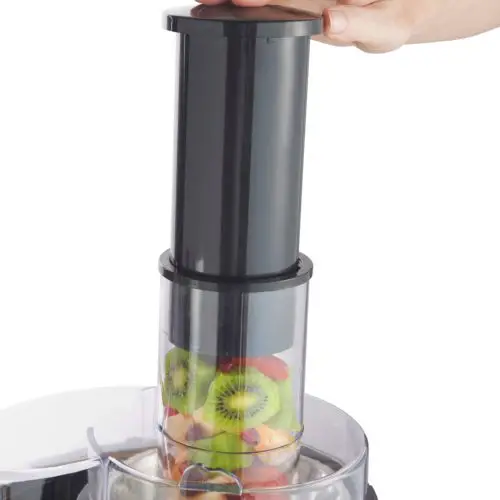 whole fruit juicer chute in action